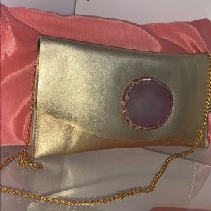 Diana Nieto leather clutch with agate stone.